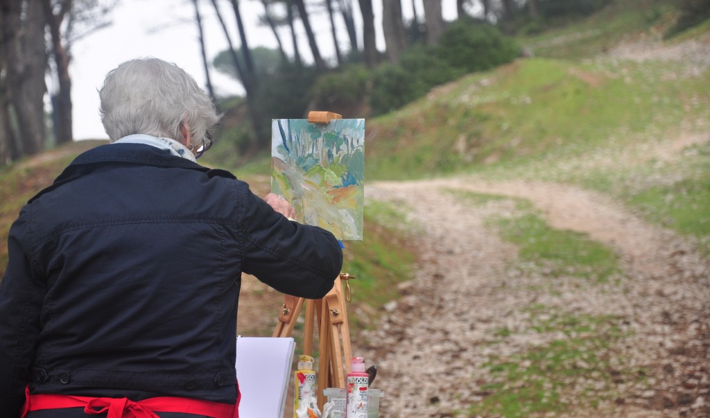 Zora Buchanan painting on a mountain road